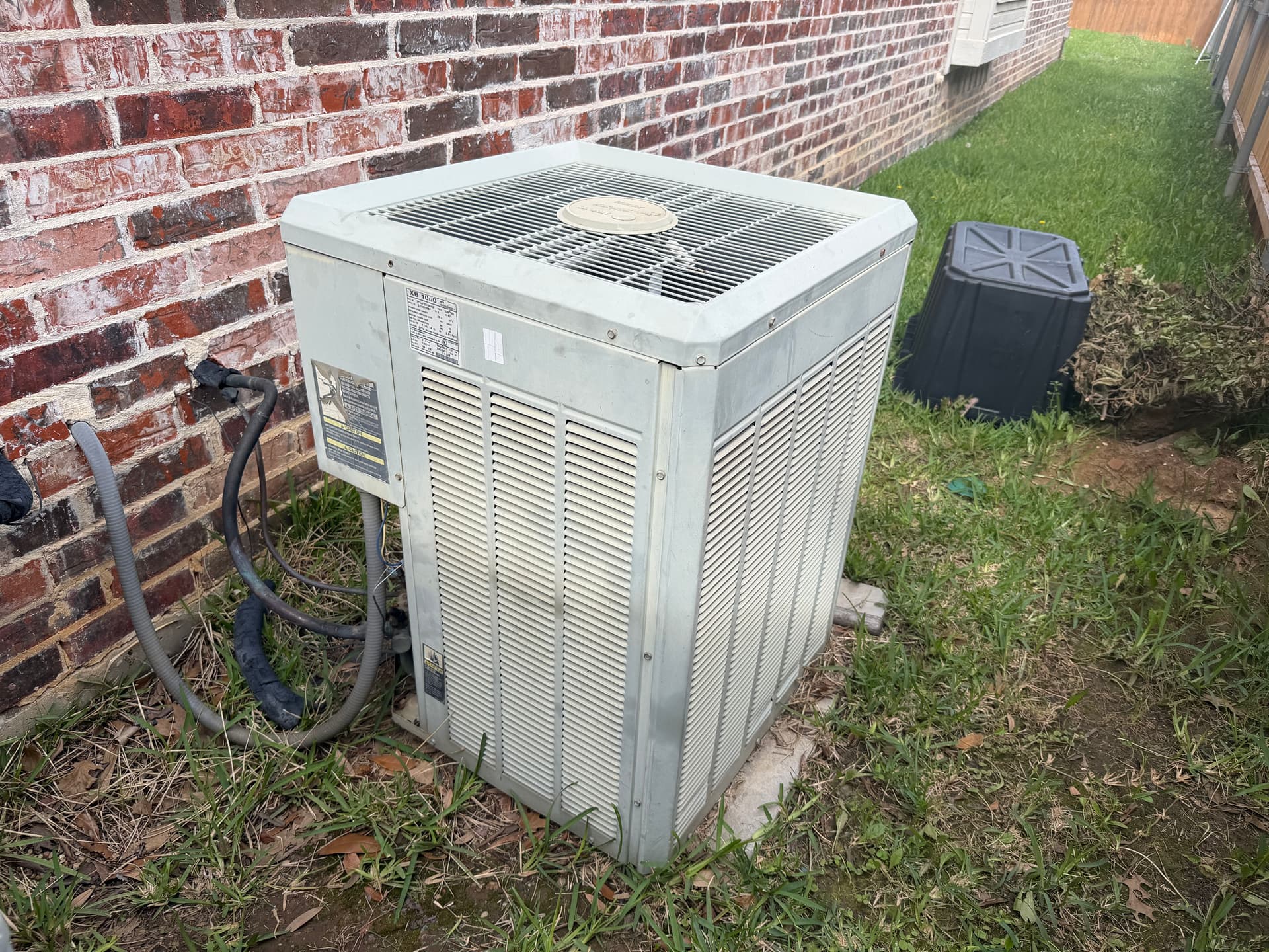 Worn Out Outdoor AC Unit Inspected in North Richland Hills image